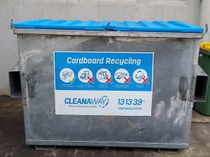A clearly labeled binshowing it is for cardboard only
