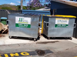 Bins clearly labeled for recycling and waste streams
